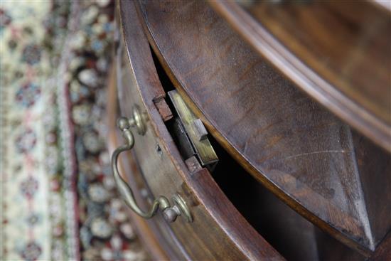 A George III mahogany oval pedestal partners desk, W.4ft 11in. D.3ft 1in. H.2ft 7in.